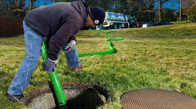 Service technician performing residential septic pumping and drainage maintenance in Scottsdale, AZ